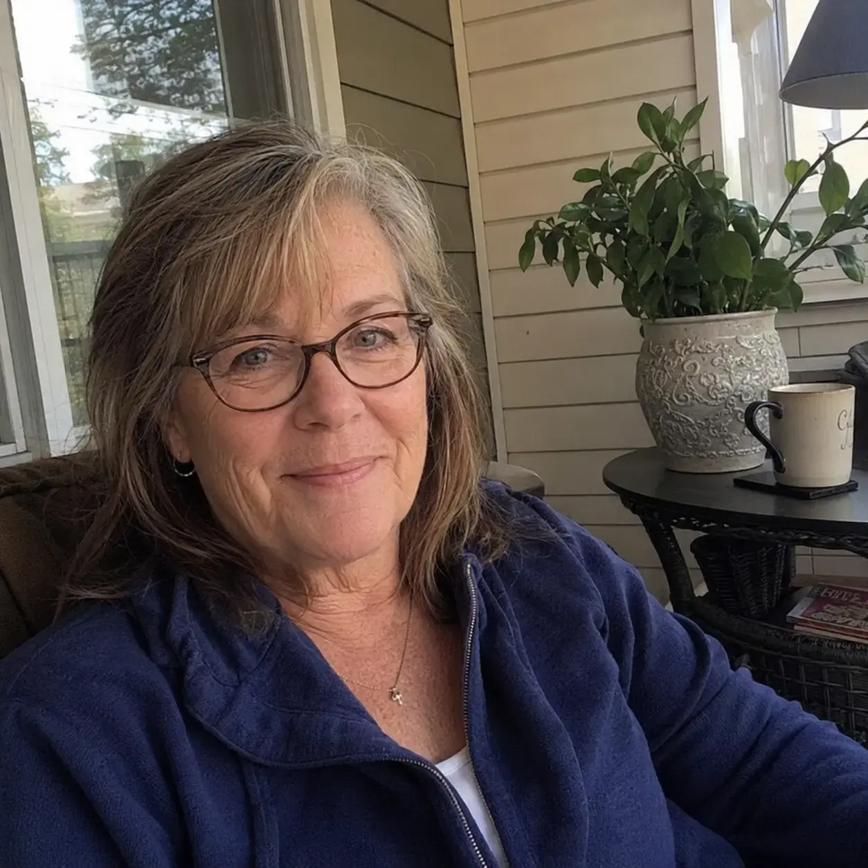 Linda Avery smiling at home in Grand Rapids.